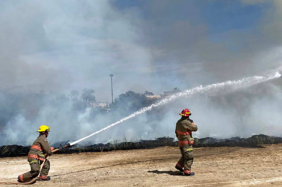 Clark County firefighters were responding to a large brush fire at Sunset Park along Sunset Roa ...