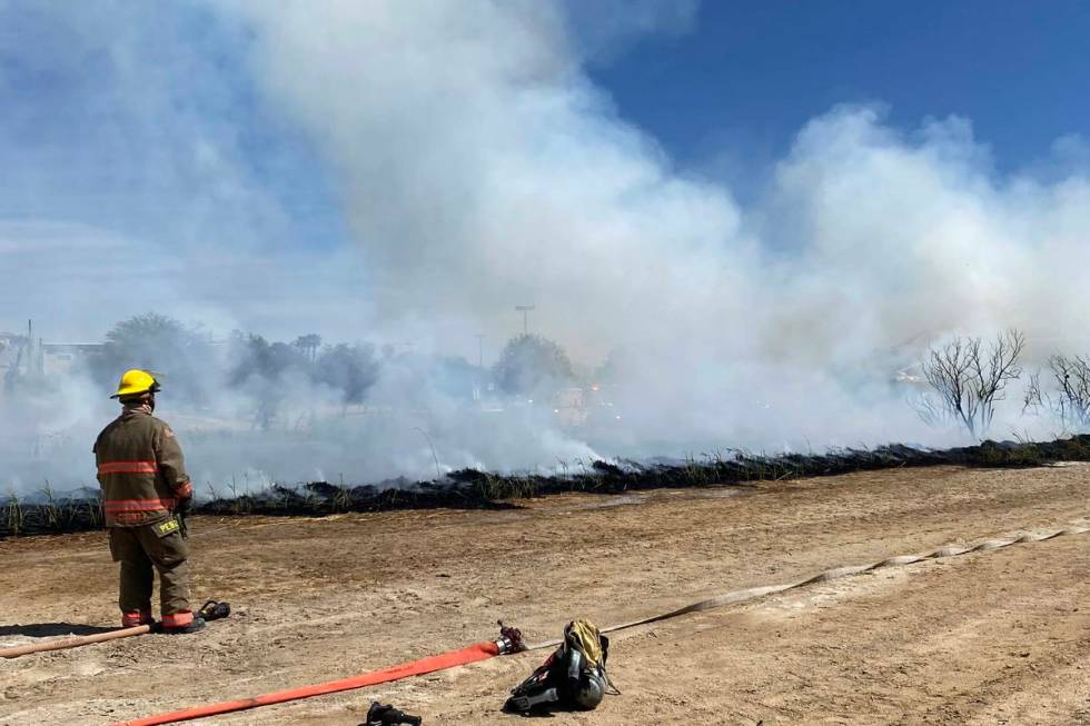 Clark County firefighters were responding to a large brush fire at Sunset Park along Sunset Roa ...