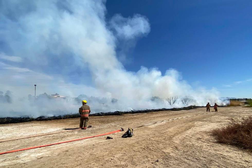 Clark County firefighters were responding to a large brush fire at Sunset Park along Sunset Roa ...