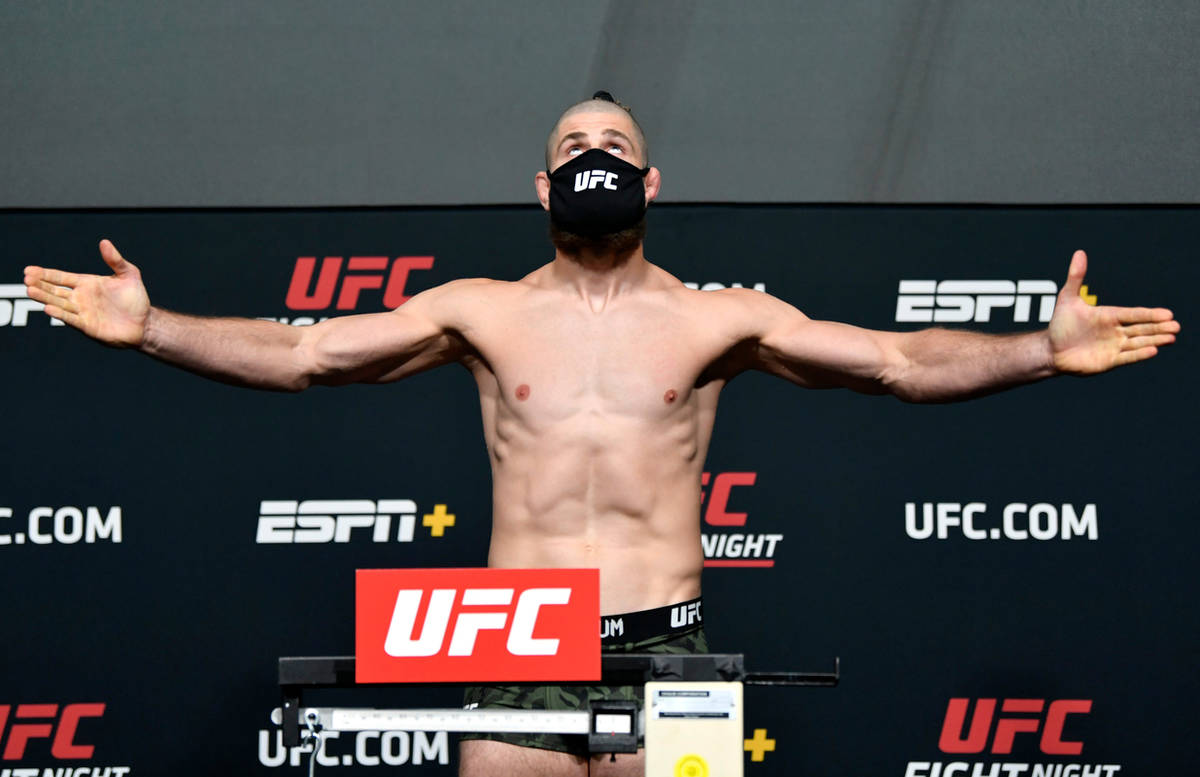 Jiri Prochazka of the Czech Republic poses on the scale during the UFC weigh-in at UFC APEX on ...