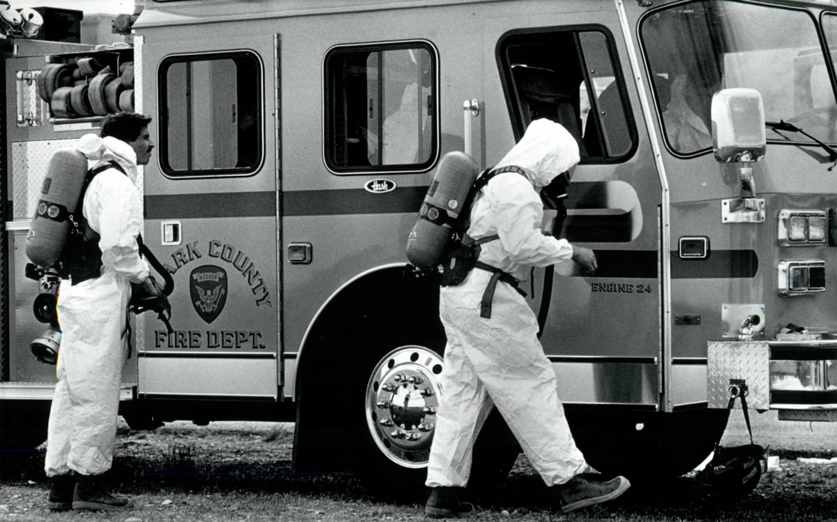 Firefighters don protective gear at the Pioneer Chlor Alkali leak on May 6, 1991, in Henderson. ...