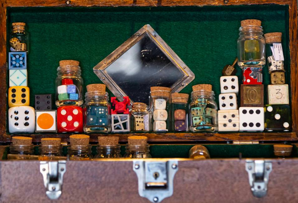 A collection of damaged and altered dice is displayed at the Office of Collecting & Design, ...