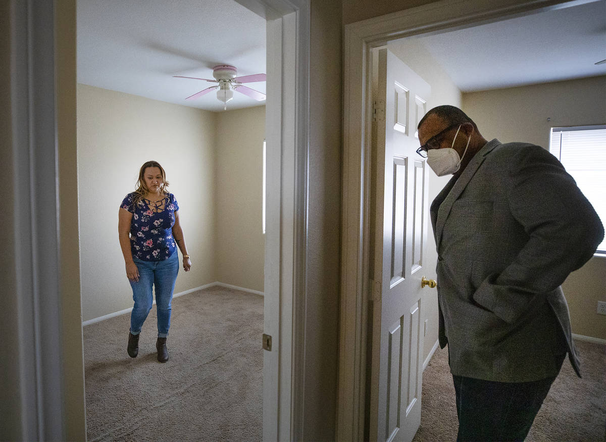 Realtor Cassidy Cotten, right, shows a home to first-time homebuyer Amy Phinsee, left, at a hom ...