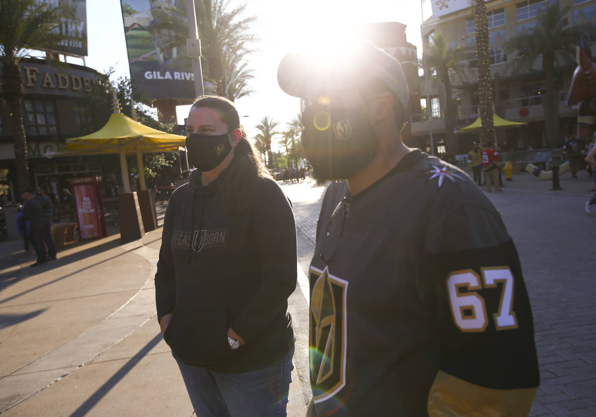 Golden Knights fans Jerilyn Coon, left, and Anton Padgett, both of Las Vegas, talk about travel ...