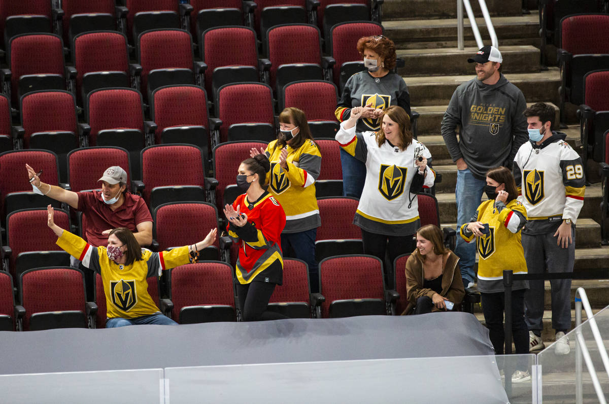 Golden Knights fans cheer on the team as they warm up before the start of an NHL hockey game ag ...