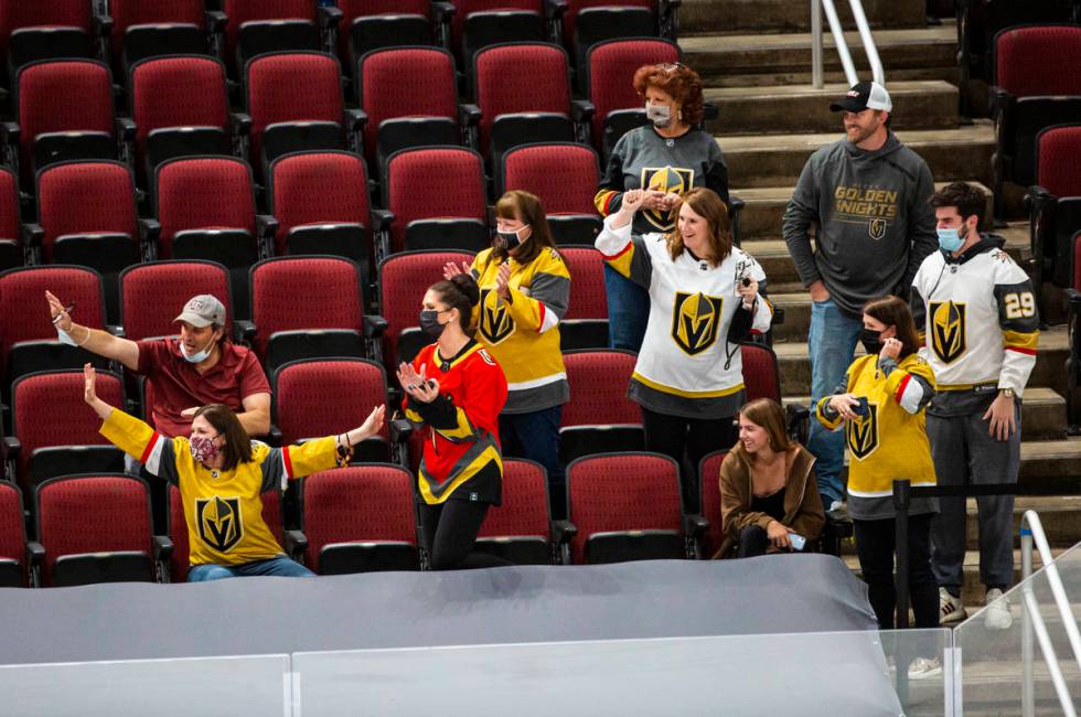 Golden Knights fans cheer on the team as they warm up before the start of an NHL hockey game ag ...