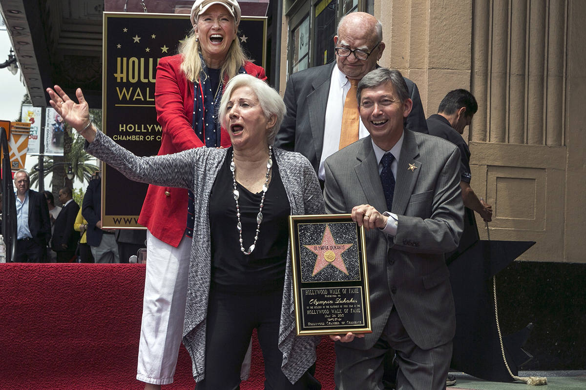 Actress Olympia Dukakis second from left, reacts as she is honored with a star on the Hollywood ...