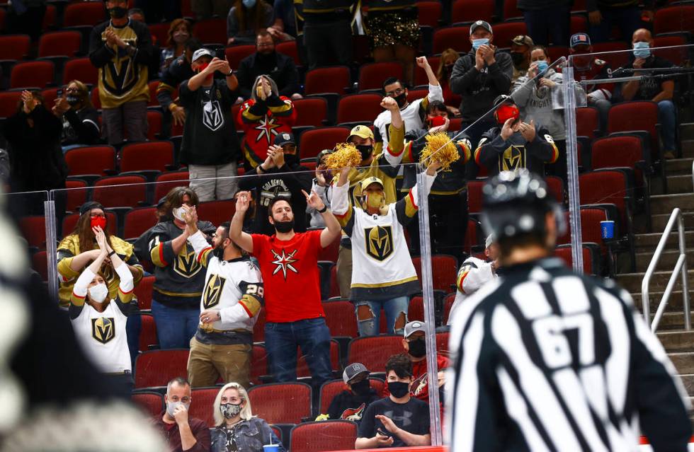 Golden Knights fans celebrate after a goal by William Karlsson, not pictured, during the first ...