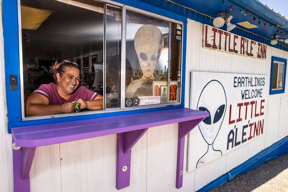 Connie West is her window service area at the Little A'Le'Inn which is open for business but a ...