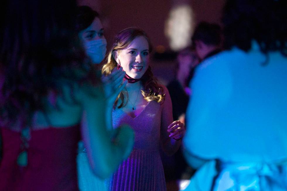 Michelle Mayers, a senior at Coronado High School, dances with her friends at a prom for junior ...