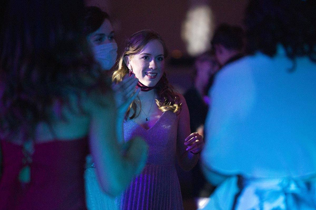 Michelle Mayers, a senior at Coronado High School, dances with her friends at a prom for junior ...