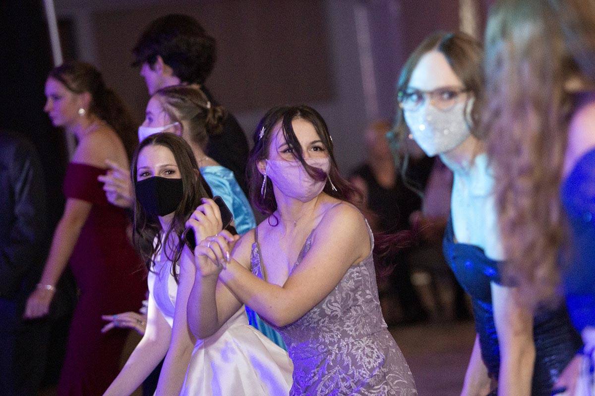 Students dance during a prom for Clark County School District juniors and seniors at Mosaic Chu ...