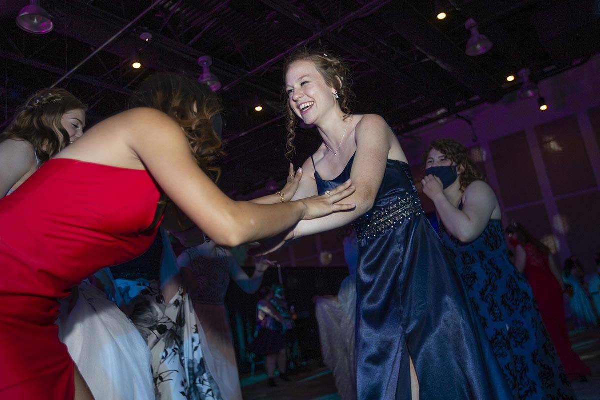 Coronado High School senior Ashlyn Hayes dances with her friends during a prom for junior and s ...