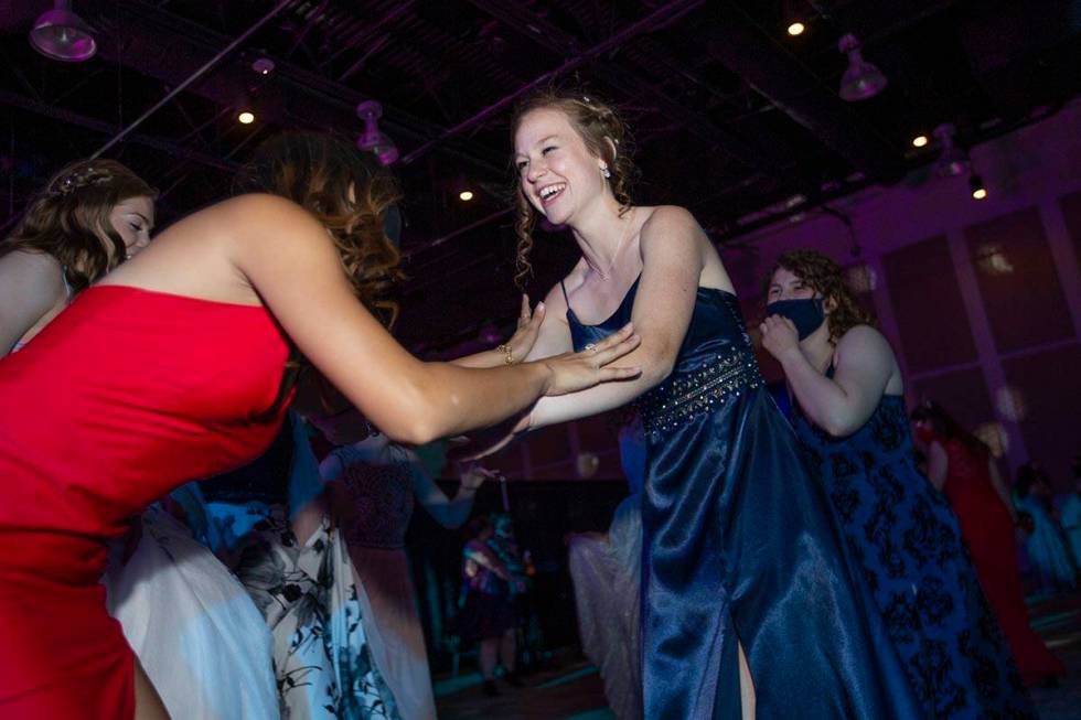 Coronado High School senior Ashlyn Hayes dances with her friends during a prom for junior and s ...