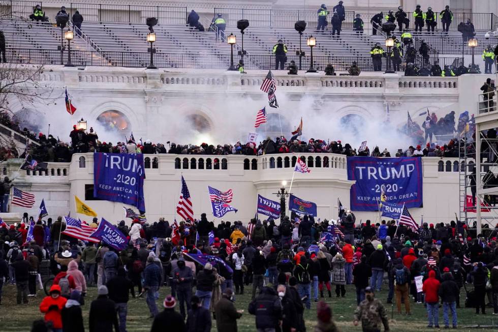 In this Jan. 6, 2021, file photo, violent rioters storm the Capitol, in Washington. With riot c ...