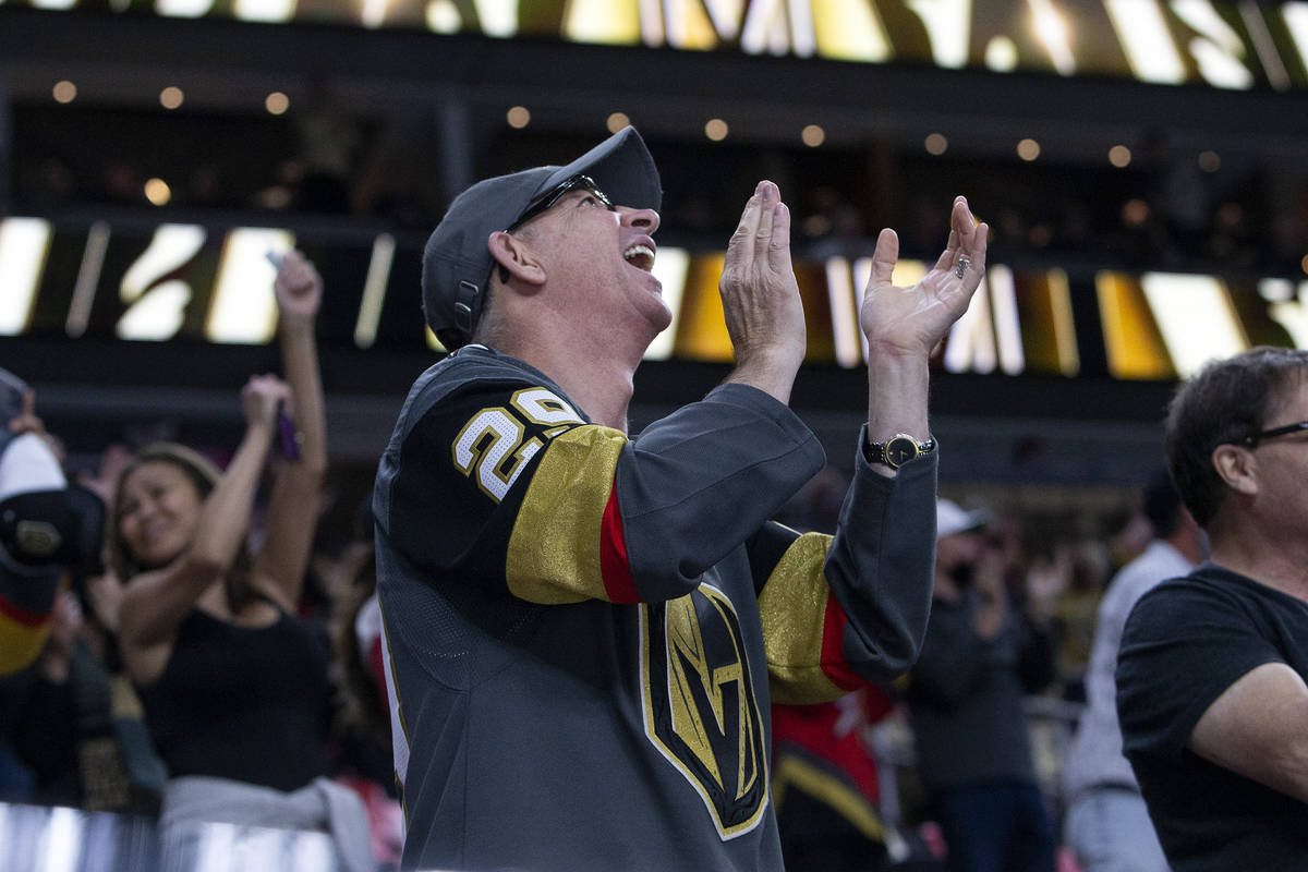 A Golden Knights fan celebrates a point scored for his team during the second period of an NHL ...