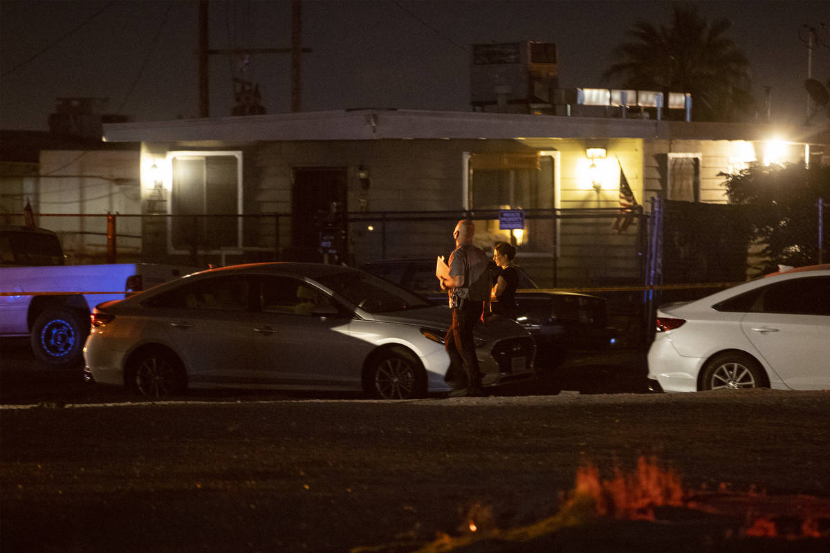 Las Vegas police investigate a body found in the 600 block of N. 10th Street, in Las Vegas, Sat ...