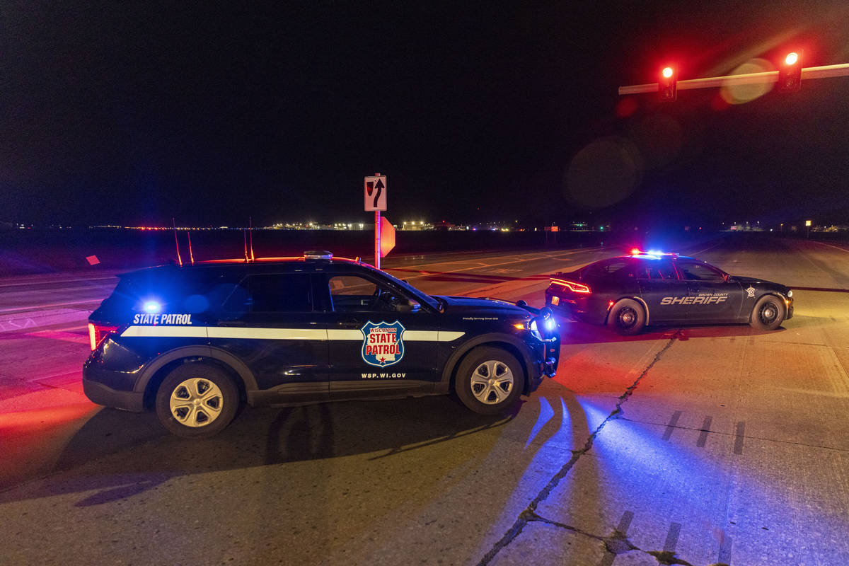 Law enforcement blocks the road in front of the Oneida Bingo and Casino in Green Bay, Wis on Sa ...