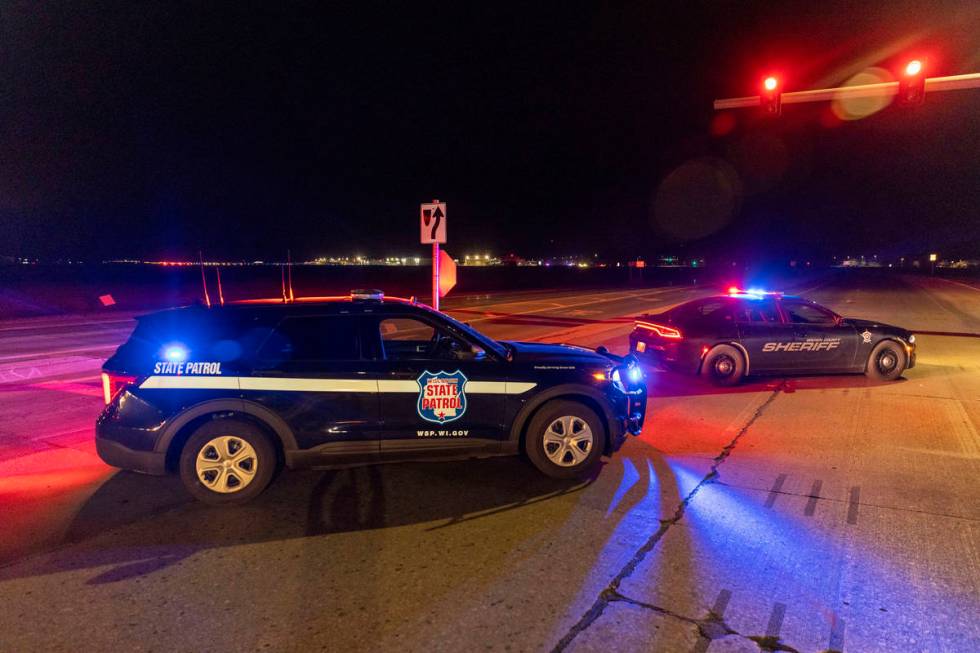 Law enforcement blocks the road in front of the Oneida Bingo and Casino in Green Bay, Wis on Sa ...