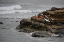 Items from a boat sit on the shoreline at Cabrillo National Monument near where it capsized jus ...