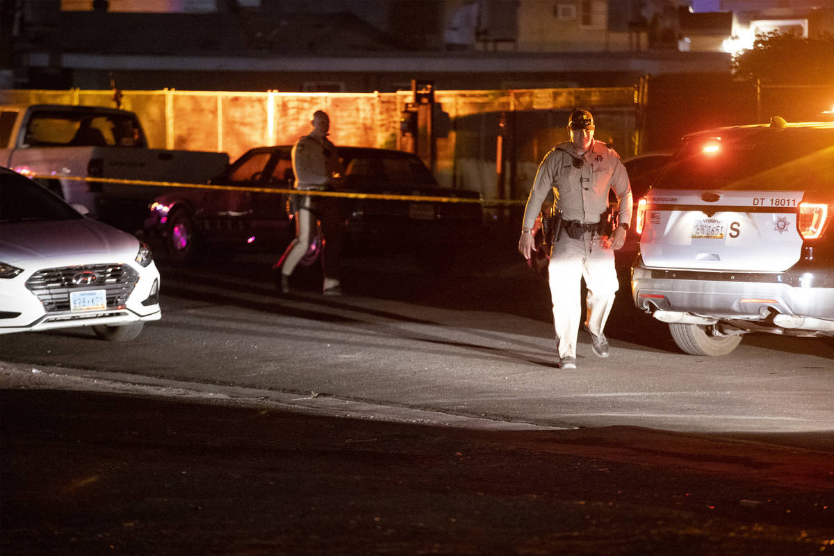 Las Vegas police investigate a body found in the 600 block of N. 10th Street, in Las Vegas, Sat ...
