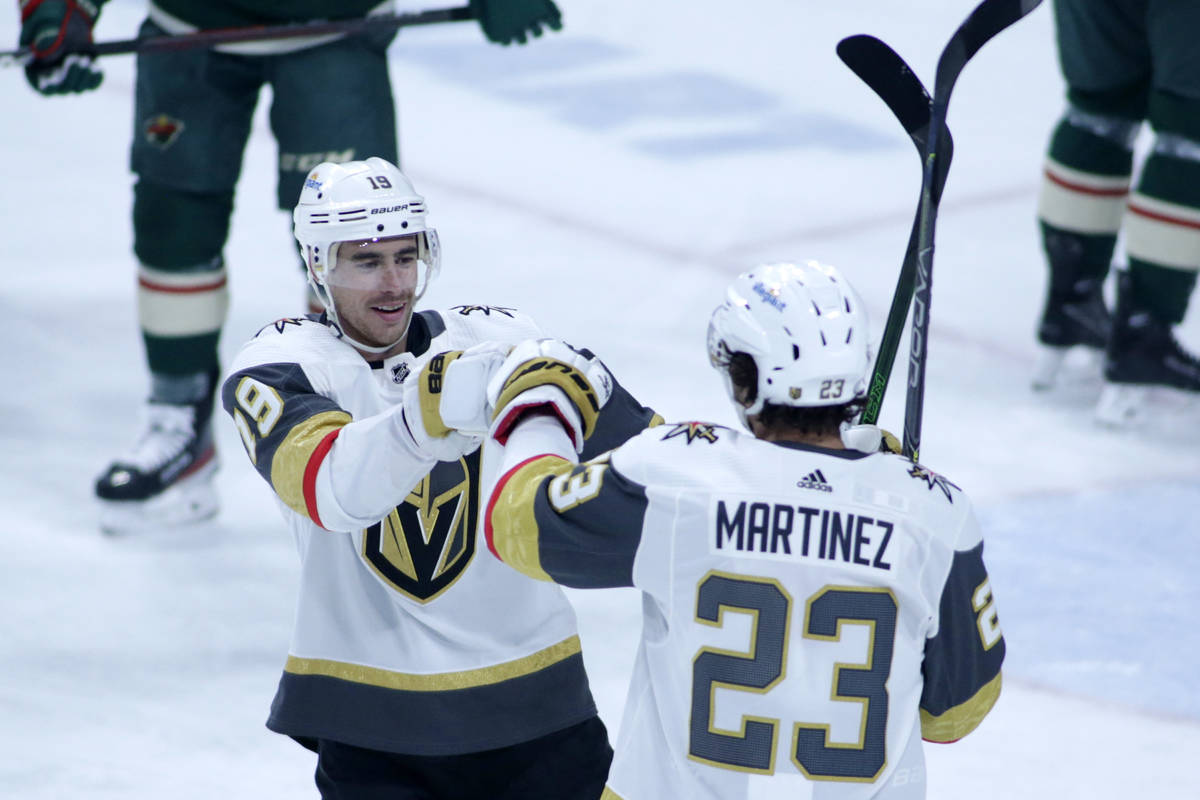 Vegas Golden Knights right wing Reilly Smith (19) and Vegas Golden Knights defenseman Alec Mart ...