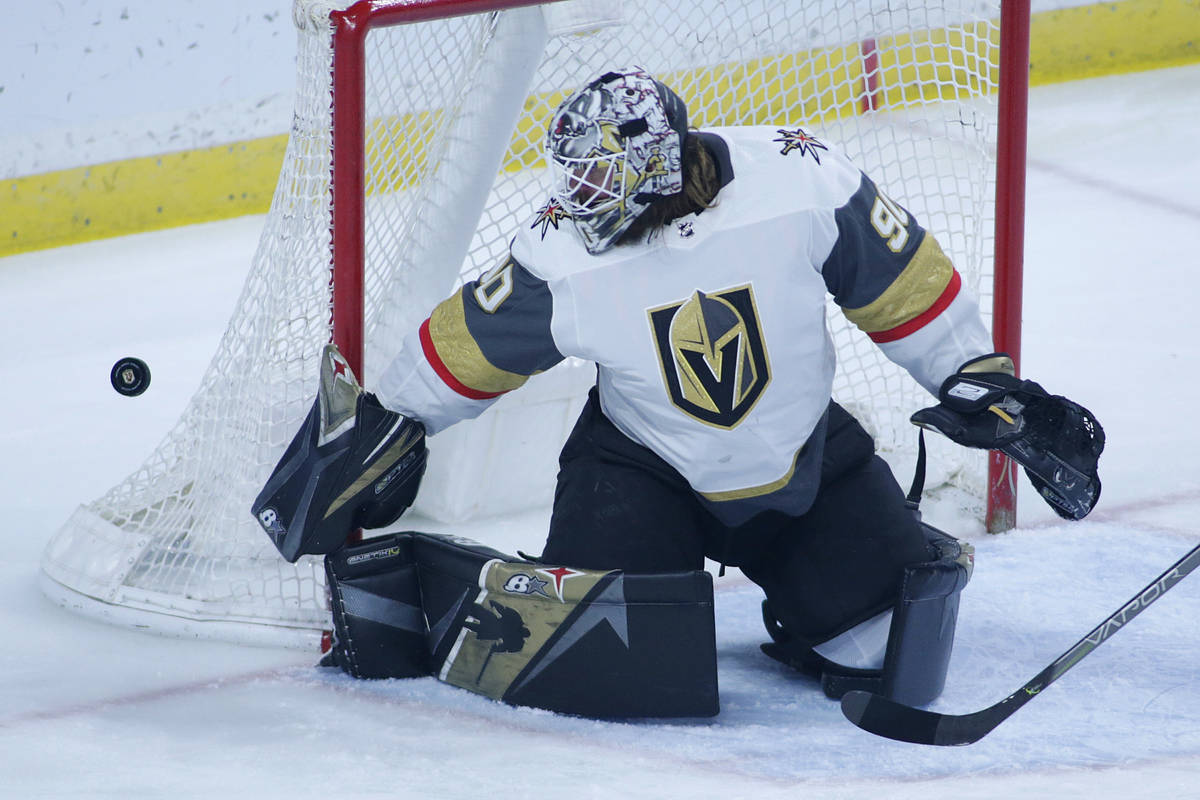 Vegas Golden Knights goaltender Robin Lehner makes a save without a stick against the Minnesota ...