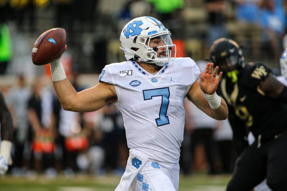 North Carolina quarterback Sam Howell (7) passes against Wake Forest in an NCAA college footbal ...