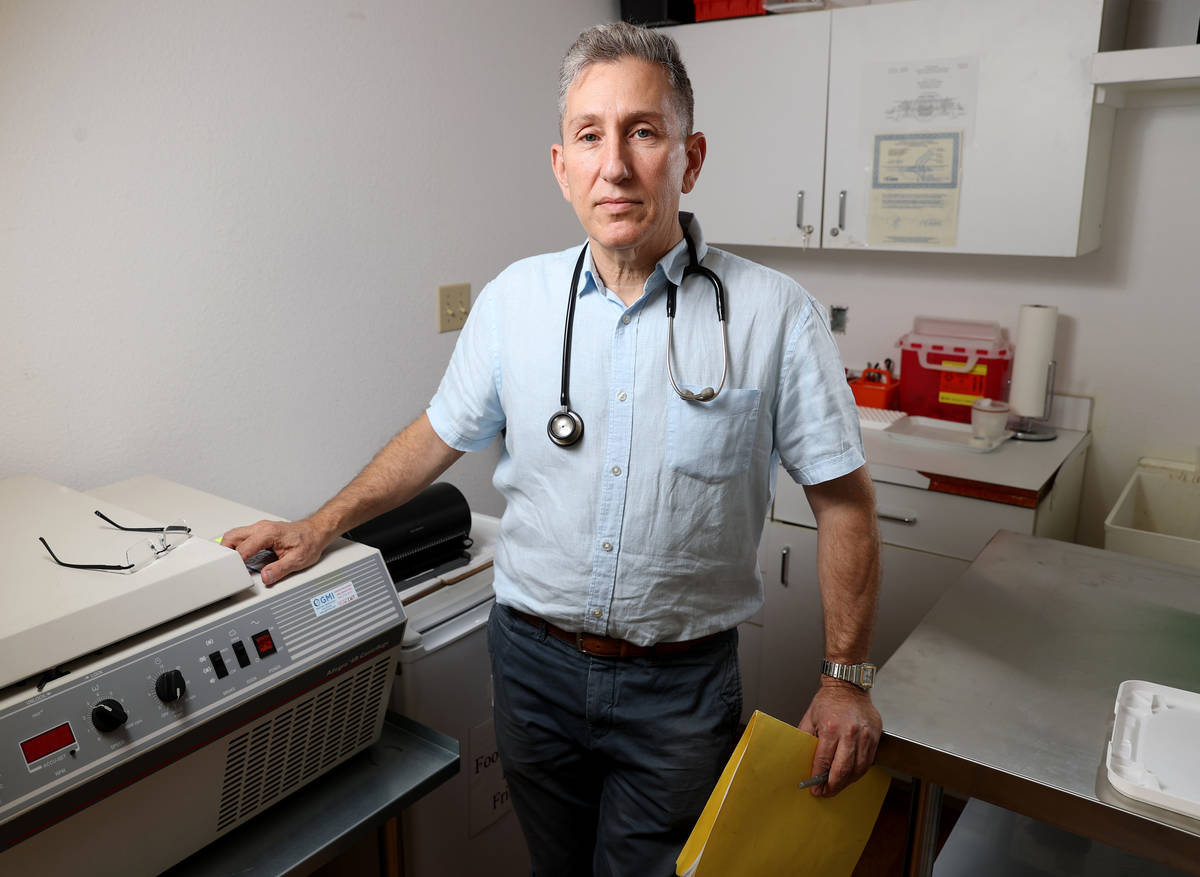 Henderson pediatrician Dr. Michael Levin Monday, May 3, 2021, with the centrifuge he will use i ...