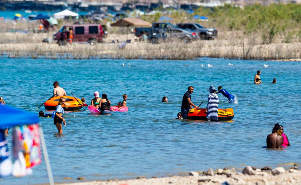 People relax in the water at Boulder Beach at Lake Mead National Recreation Area on Wednesday, ...