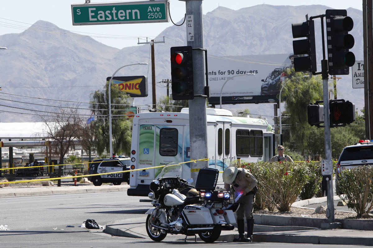 Police investigate a crash involving a bus and a pedestrian Tuesday, May 4, 2021, at the inters ...