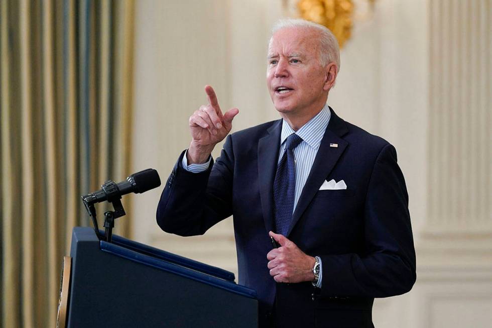 President Joe Biden takes questions from reporters as he speaks about the COVID-19 vaccination ...