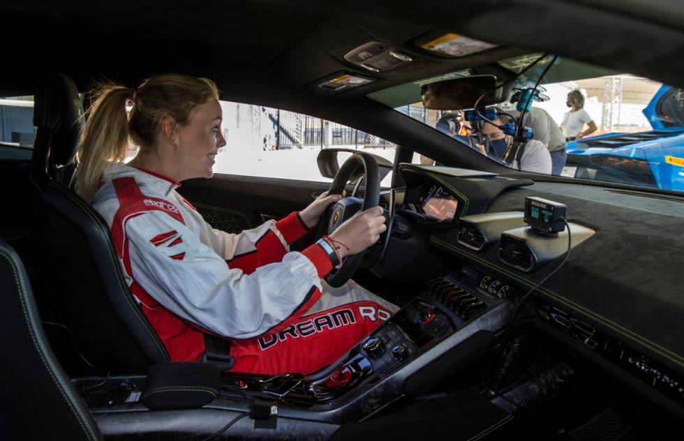 UNLV head women's basketball coach Lindy La Rocque is ready to drive as she gets behind the whe ...
