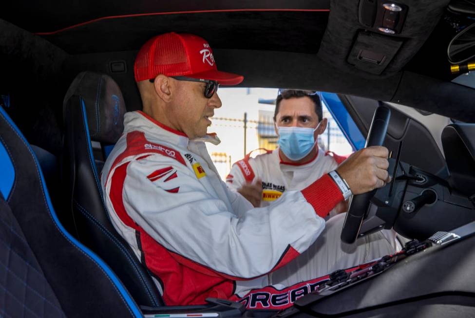 UNLV head football coach Marcus Arroyo behind the wheel with instructor Vinny Mykulak while pre ...
