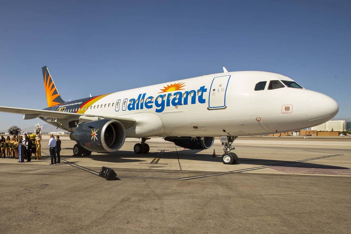 Dignitaries and team members gather as Allegiant unveils a new Golden Knights-themed plane at M ...