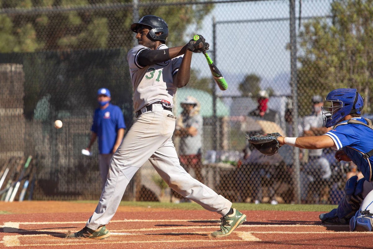 Palo Verde's first baseman Karthik Gondy (31) swings and misses during a high school baseball g ...