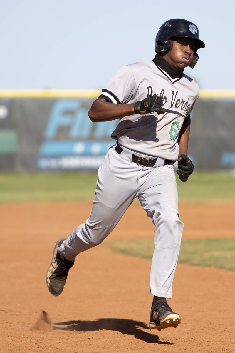 Palo Verde's left fielder Corey Stratton (6) rounds the bases to third during a high school bas ...