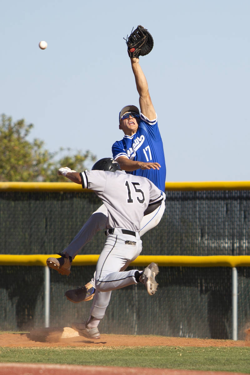 Bishop Gorman's first baseman Tai Nyugen (17) jumps to catch while Palo Verde's pitcher Jason S ...