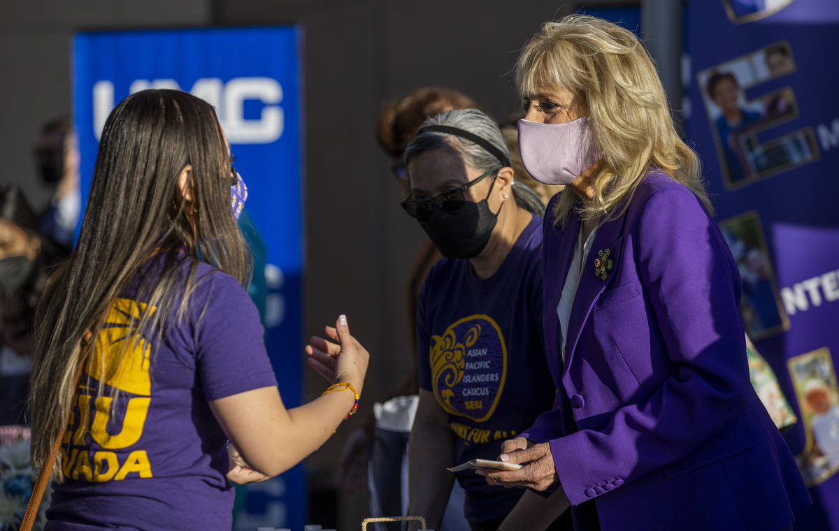 First Lady Jill Biden talks with a staff person at the University Medical Center joining the Se ...