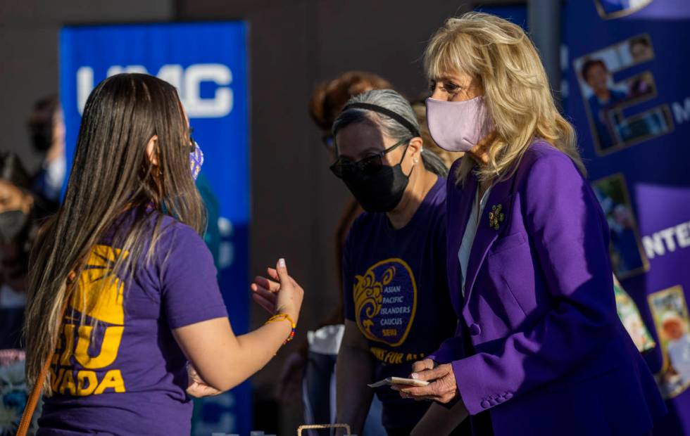 First Lady Jill Biden talks with a staff person at the University Medical Center joining the Se ...