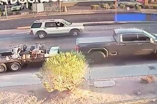 Police described the truck involved in Wednesday's hit-and-run as a newer dark gray GMC crew ca ...