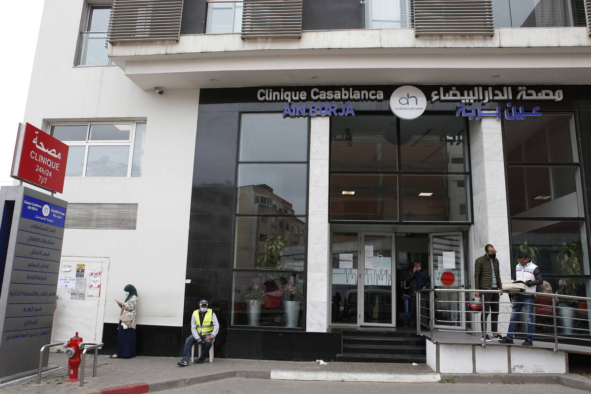 People wait in front of the Ain Borja private clinic in Casablanca, Morocco, Wednesday, May 5, ...