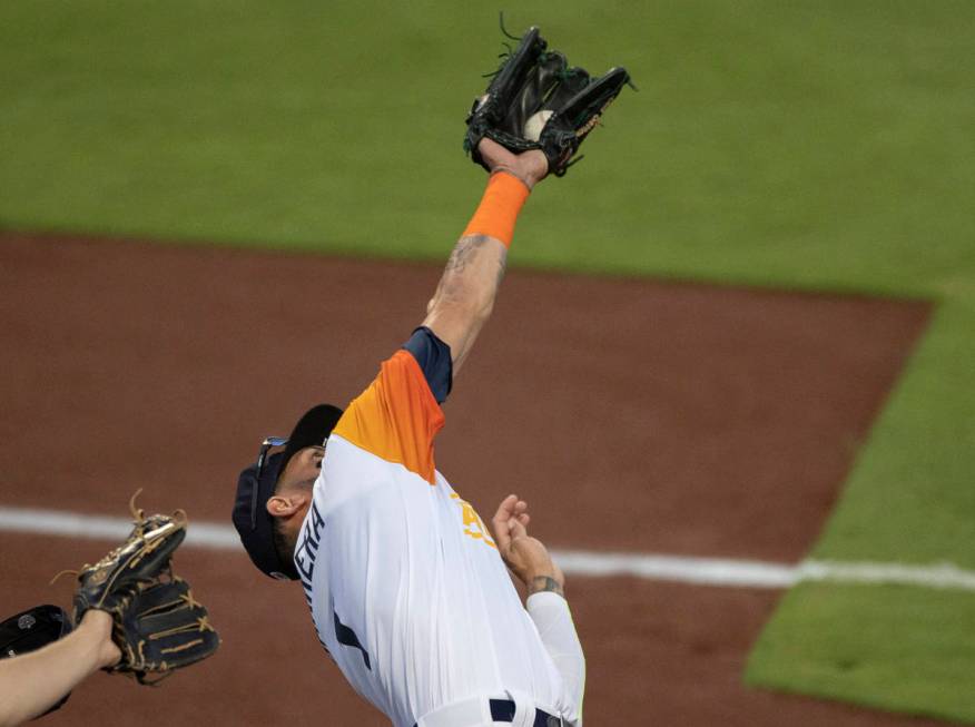 Las Vegas Aviators outfielder Luis Barrera (1) makes a diving catch in the bottom of the third ...