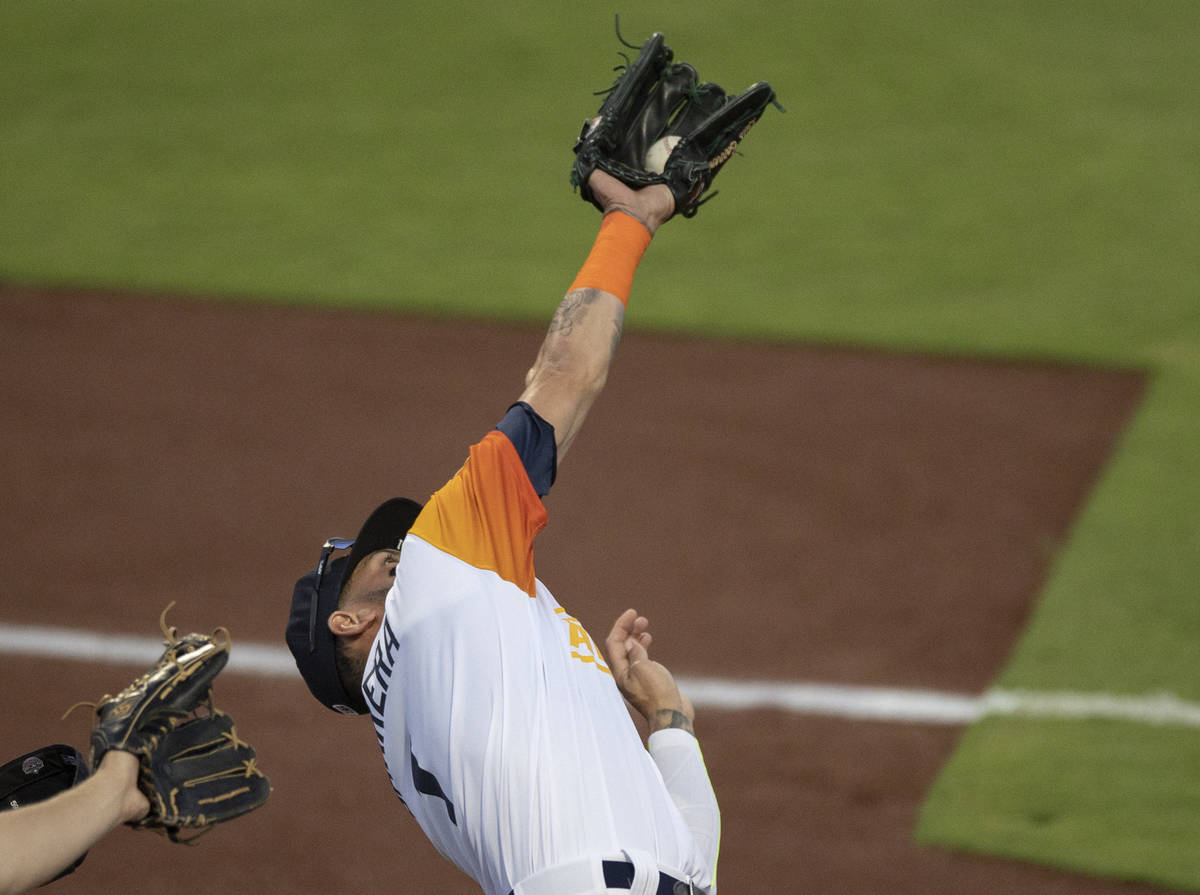 Las Vegas Aviators outfielder Luis Barrera (1) makes a diving catch in the bottom of the third ...