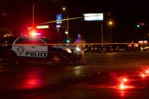 Officers investigate a fatal hit-and-run crash in northeast Las Vegas close to East Lake Mead B ...
