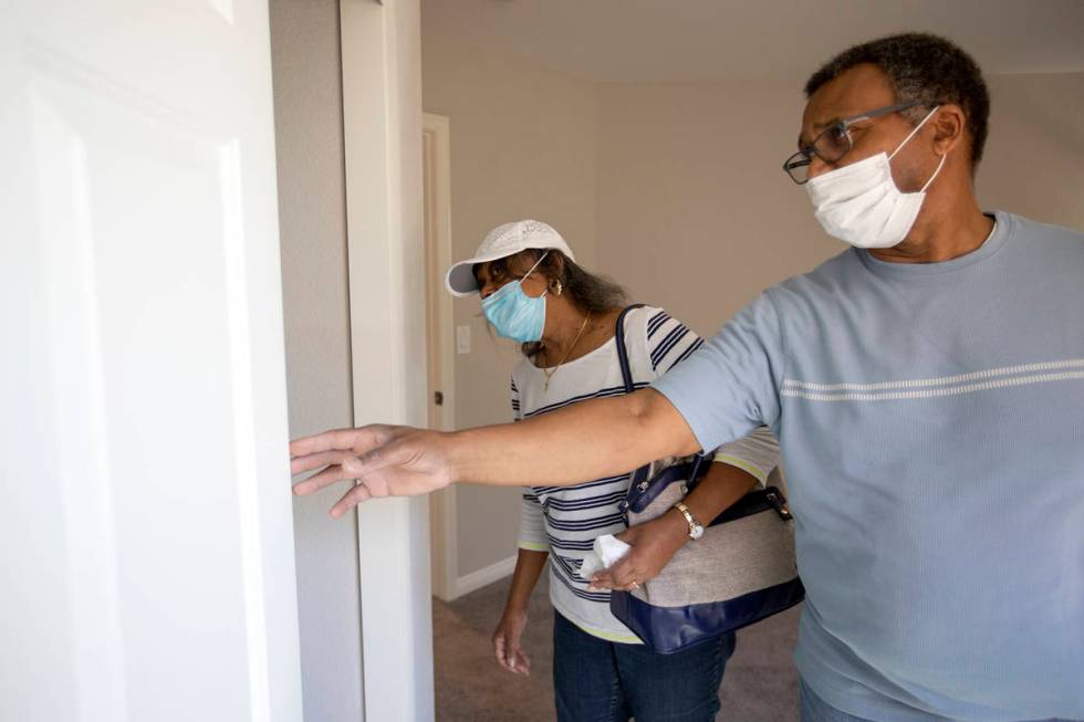 Evelyn Williams and Daryl Williams check out the closet space during an open house at 2412 Crag ...