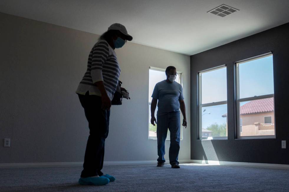 Evelyn Williams and Daryl Williams view the second floor during an open house at 2412 Craggy Le ...