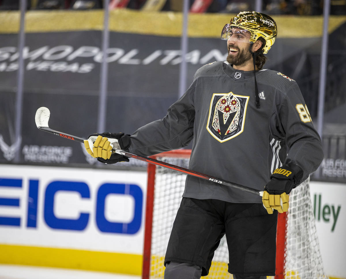 Golden Knights right wing Alex Tuch (89) laughs teammates during the warm-up period of an NHL g ...