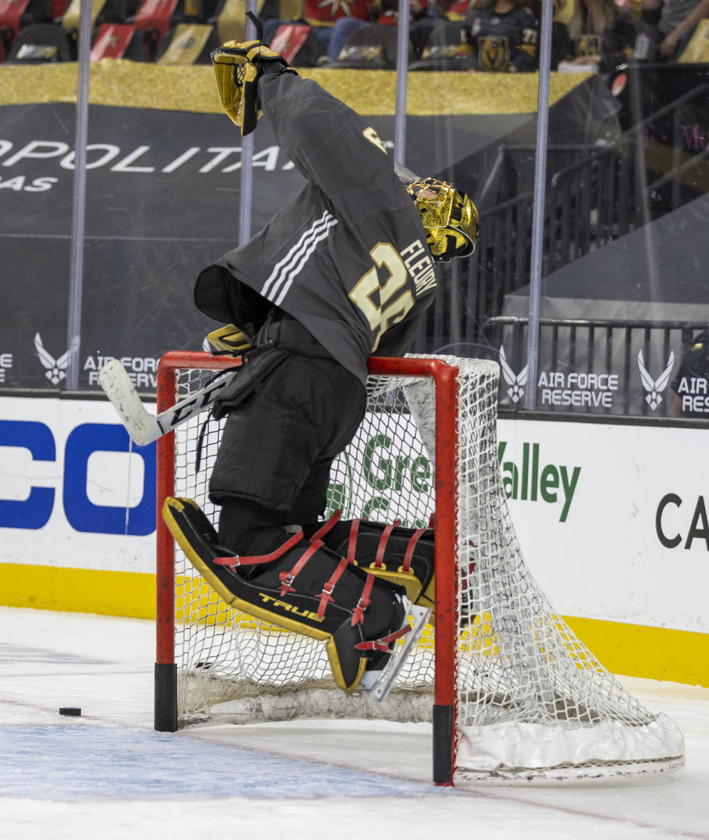 Golden Knights goaltender Marc-Andre Fleury (29) leaps to catch a puck during the warm-up perio ...