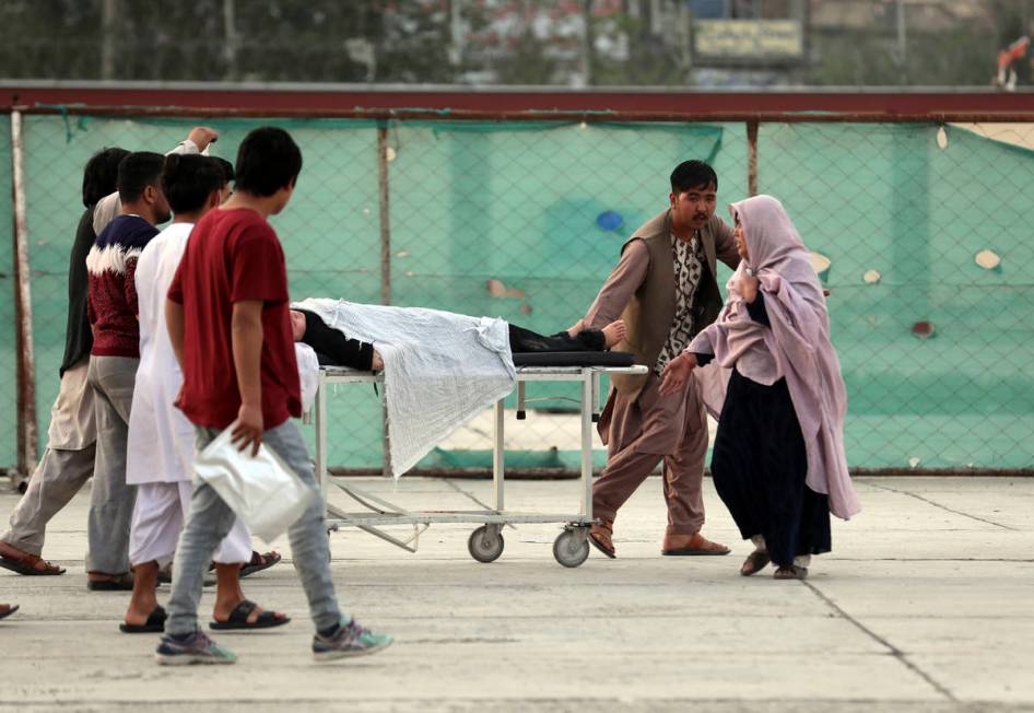 An injured school student is transported to a hospital after a bomb explosion near a school wes ...